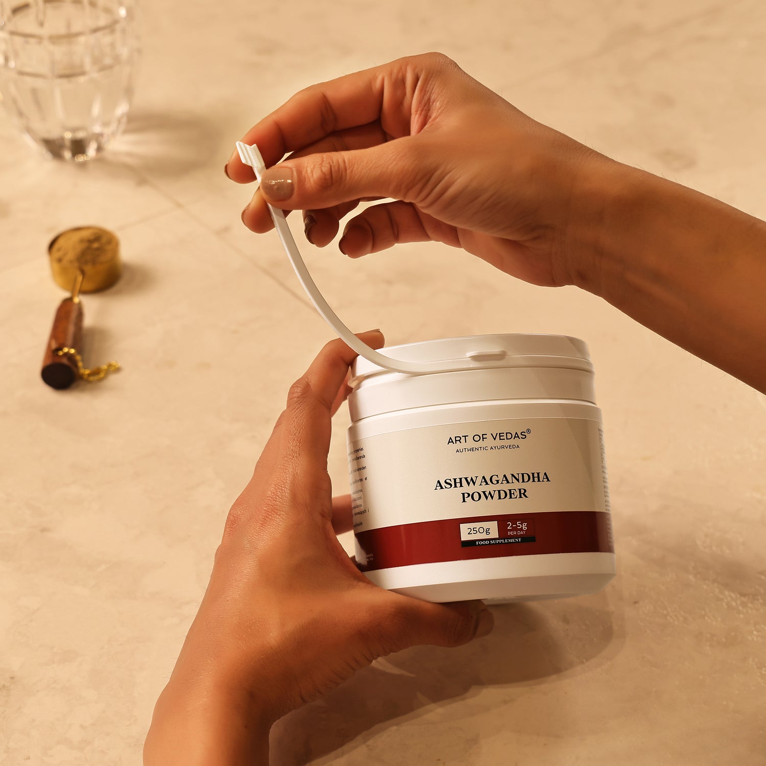 Art of Vedas Ayurvedic Herbal Powders - Hands Opening Ashwagandha Powder Container with Spoon for Ayurvedic Supplement Preparation